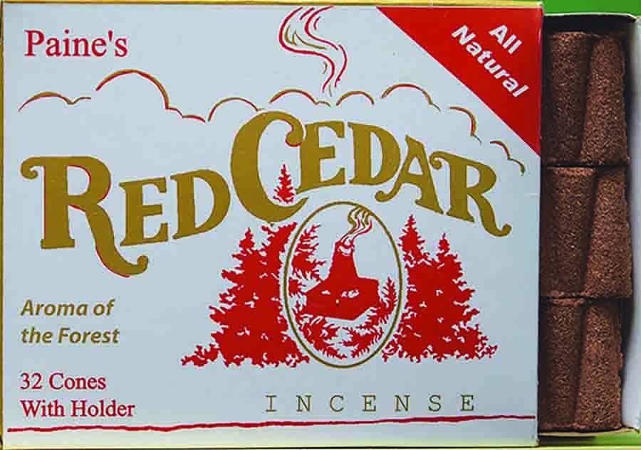 Box of Paine's Red Cedar incense with incense cones on a white background