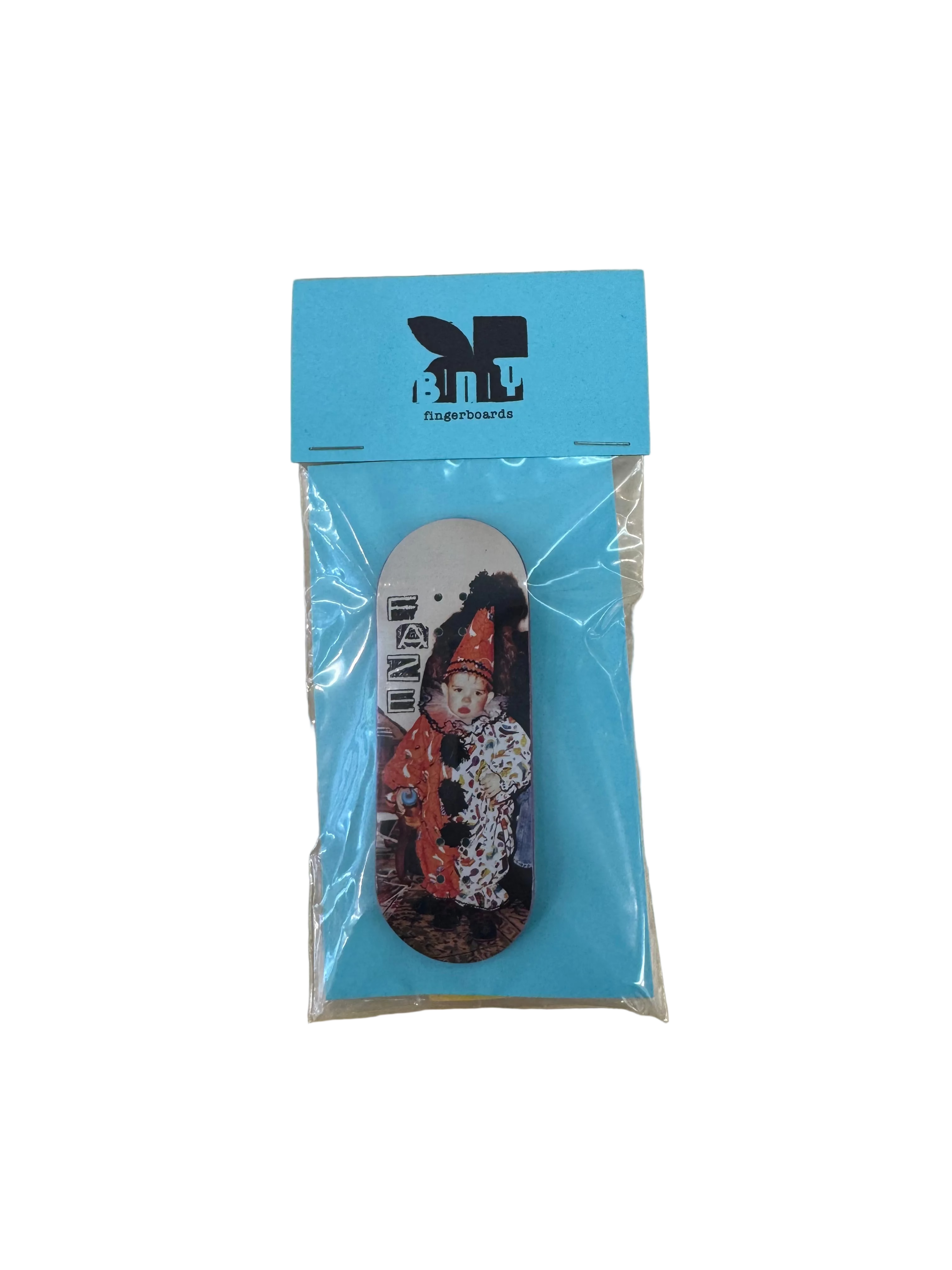 A miniature finger skateboarding deck in clear plastic packaging with a bright blue header card. The card features the 'Bunny Fingerboards' brand logo and name in black.