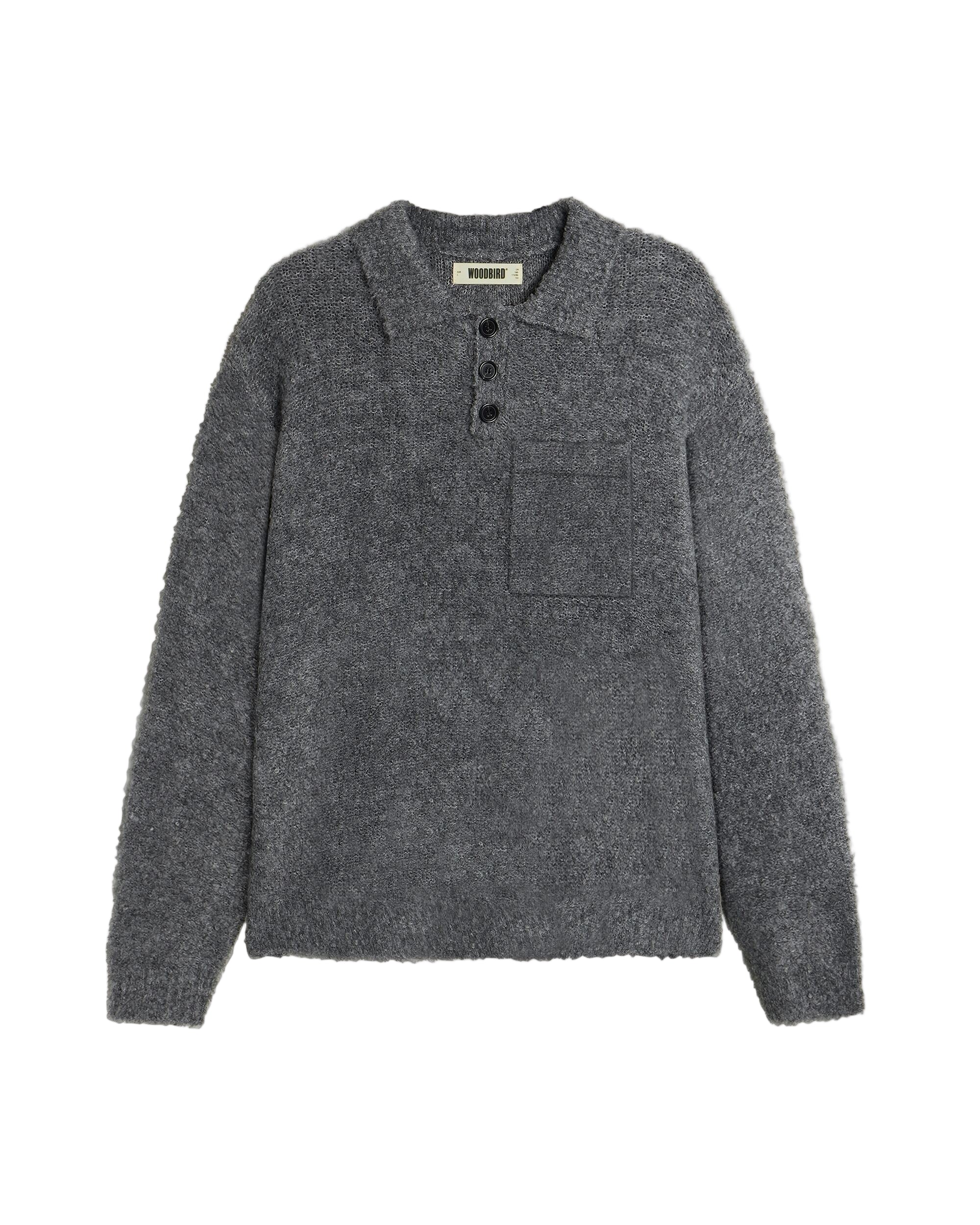 Gray sweater with button details on a beige background