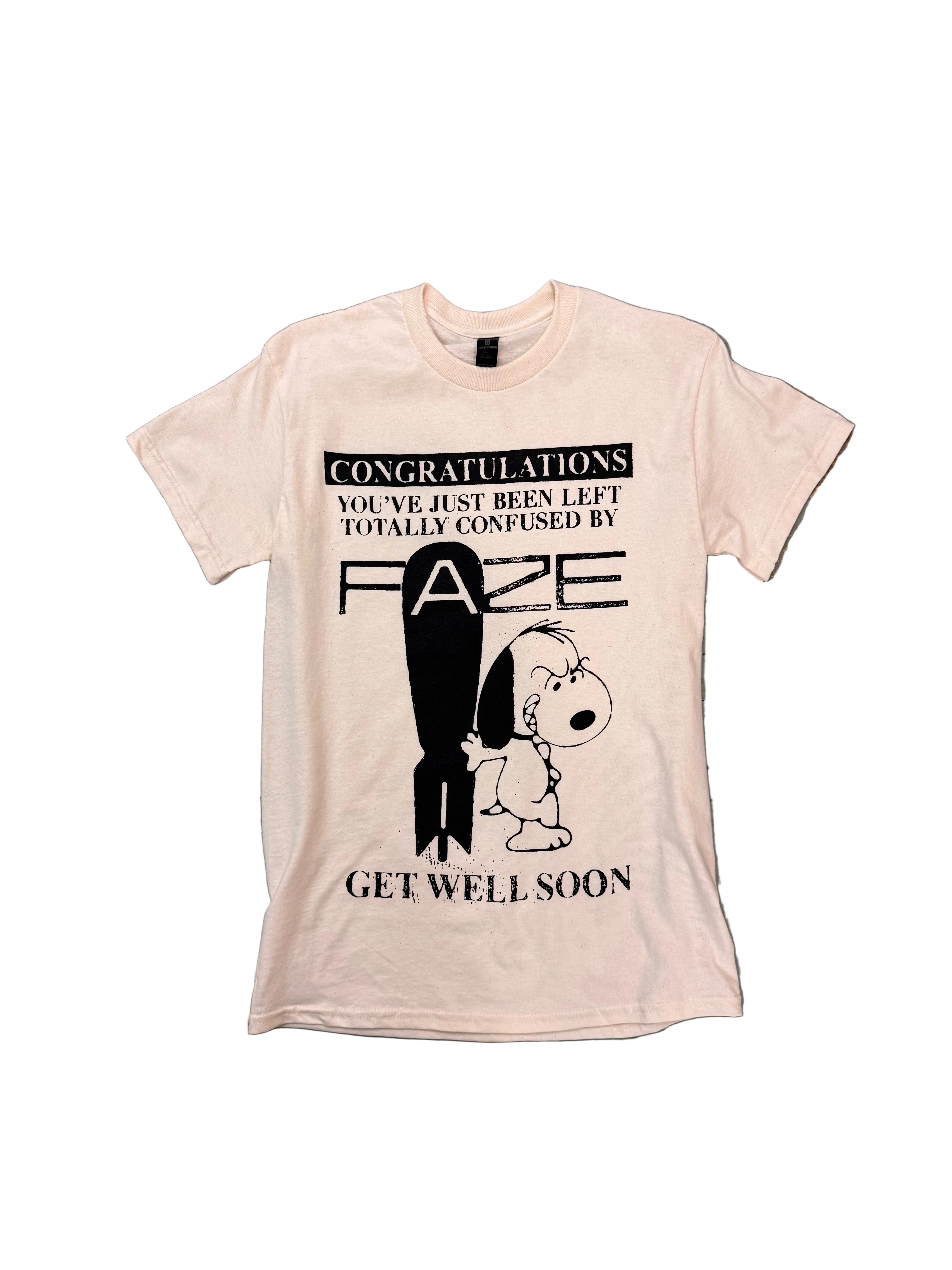 a natural t-shirt with a black graphic of snoopy standing next to the atom bomb. text reads 