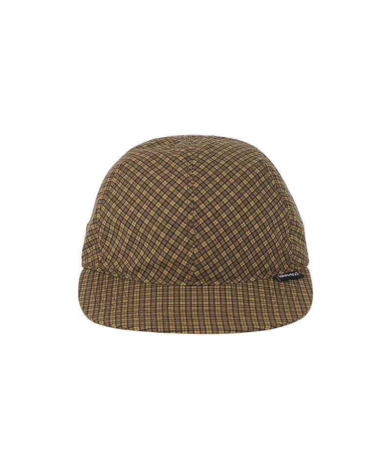 A brown and tan plaid five-panel camp cap with a small black and white logo patch on the side, set against a plain white background.