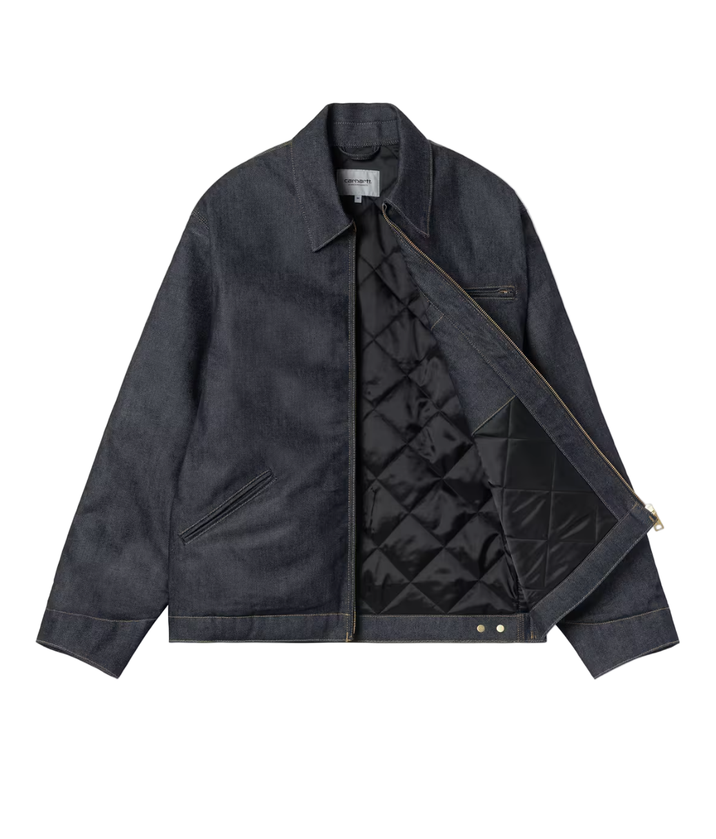 Dark denim jacket with quilted lining on a light gray background