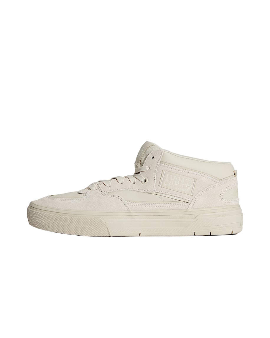 Beige high-top sneaker on a light gray background
