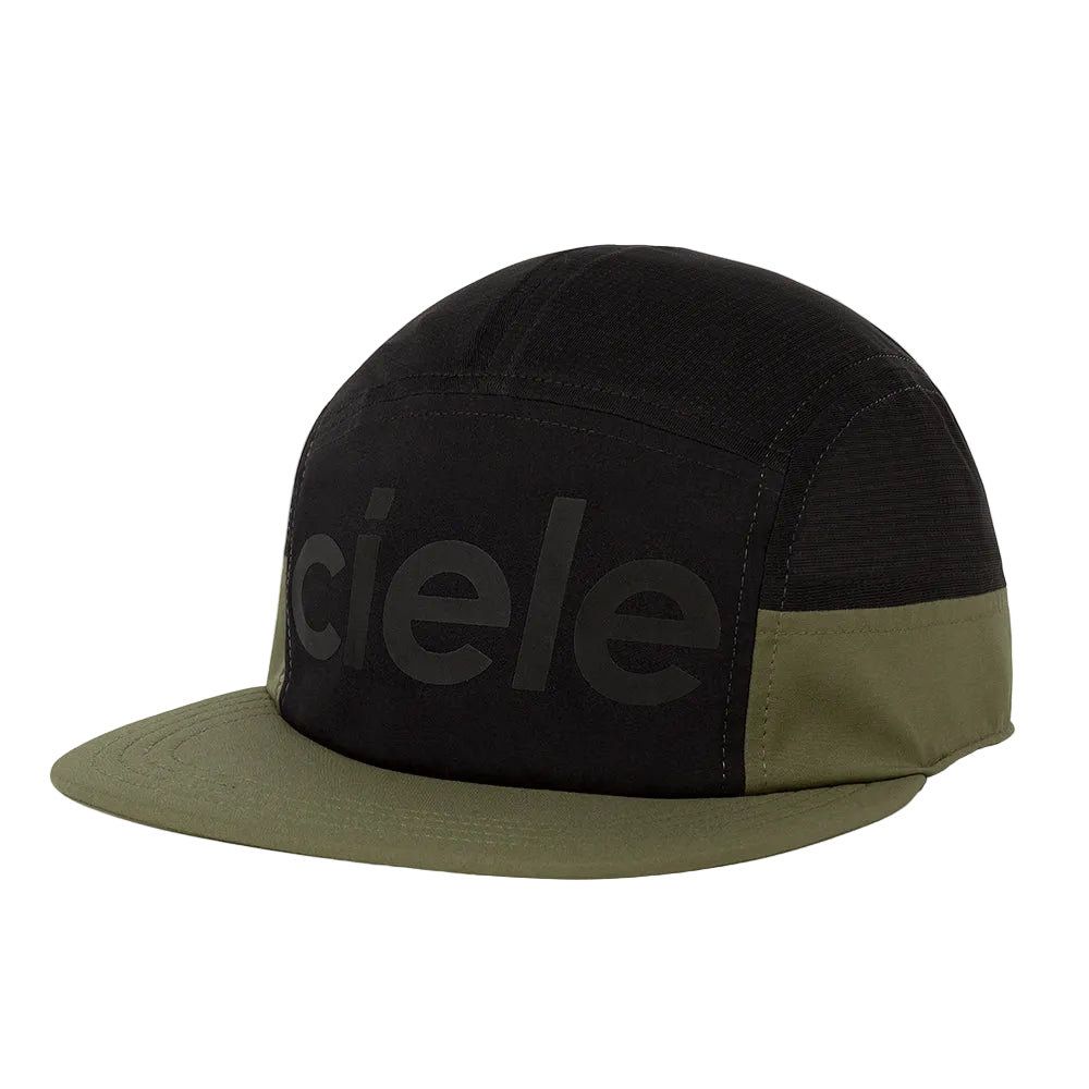 A black and olive green 5-panel cap with a flat brim, featuring a large tonal 'ciele' logo on the front panel, photographed on a clean white background.
