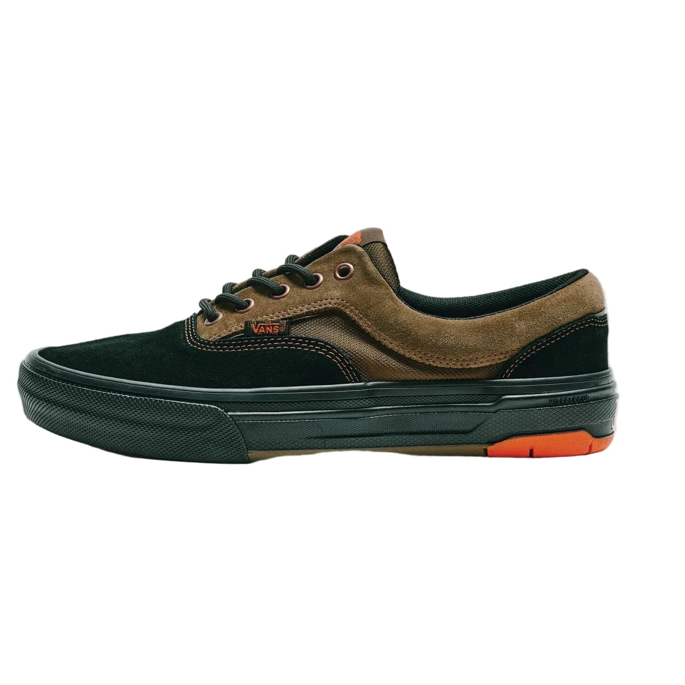 Sneaker with black and brown design on a white background