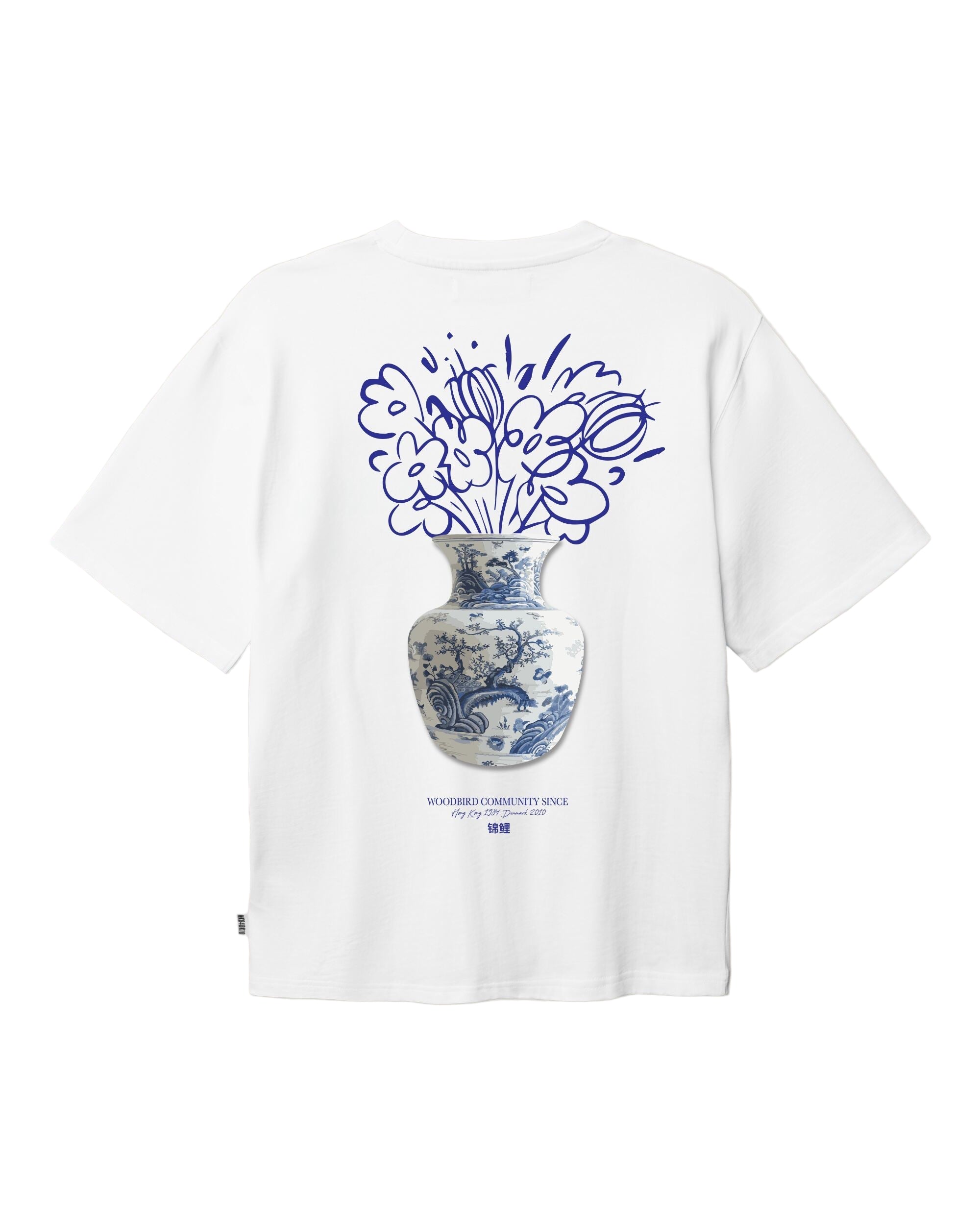 White t-shirt with blue floral design on a beige background