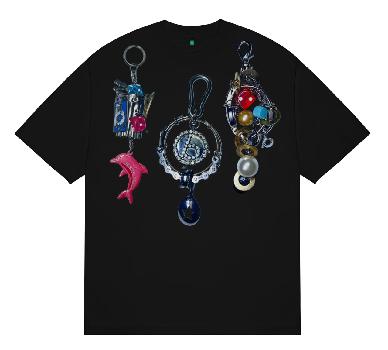 A black short-sleeve crewneck t-shirt featuring a large graphic print of three ornate keychains on the front. The keychains include a pink dolphin charm, a silver compass with a blue clock face, and a beaded keychain with red, gold, and white beads.