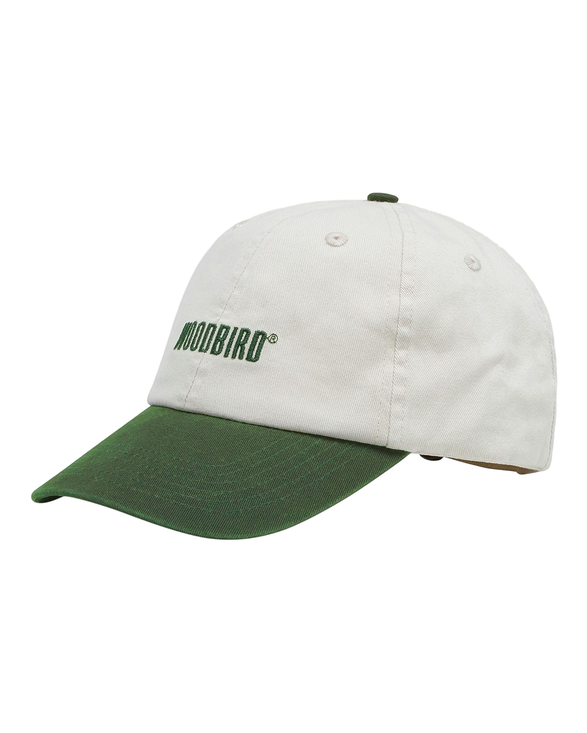 White and green cap with 'Woodbird' logo on a beige background