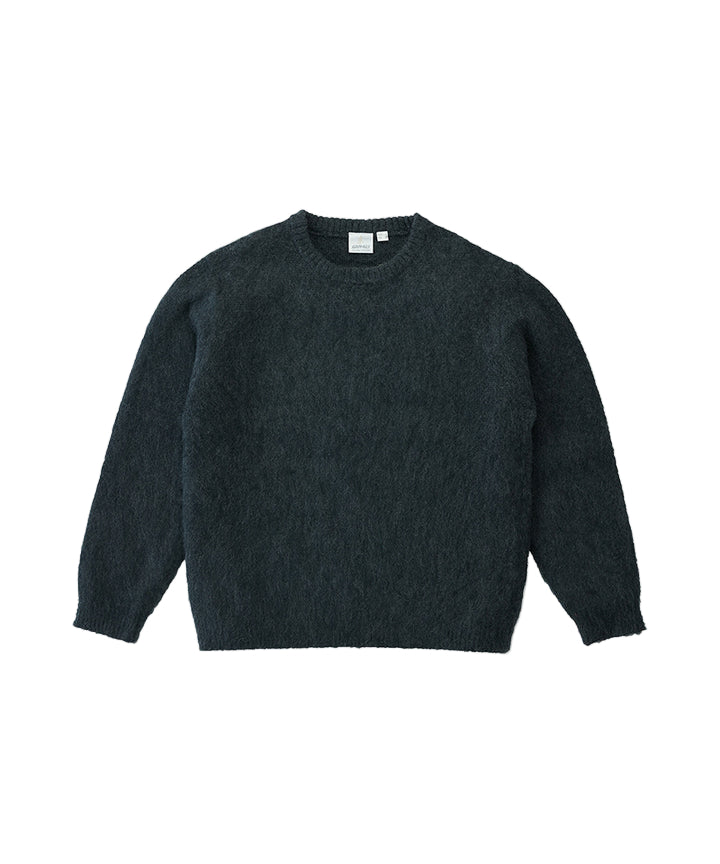 Dark gray sweater on a light gray background