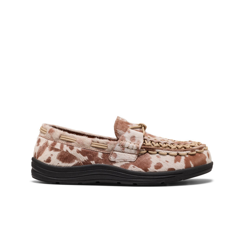 KEEN Men's UNEEK Loafer in Nocturnal Cow Red, featuring a premium leather upper, slip-on construction, and distinctive cow-print design.